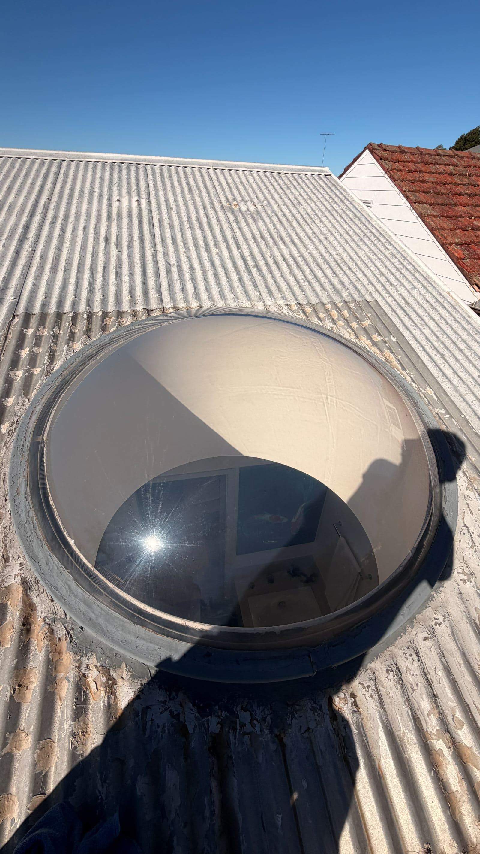 Cleaning in progress on a skylight at a Dee Why apartment