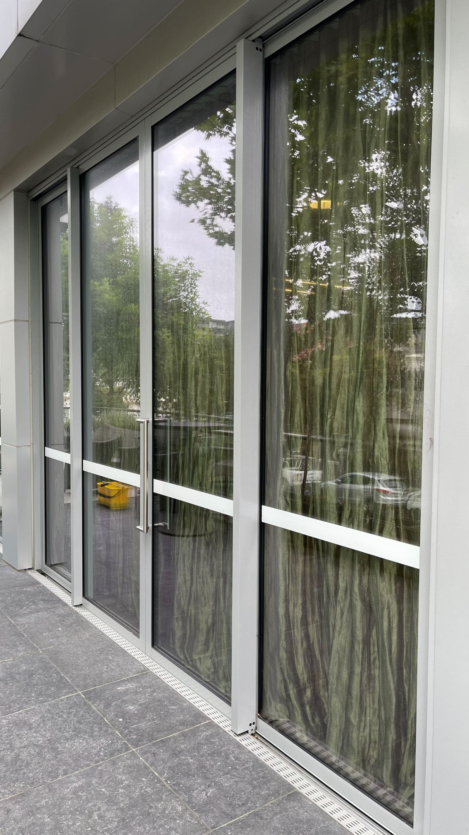 Cleaned office glass entry doors at a Sydney car dealership